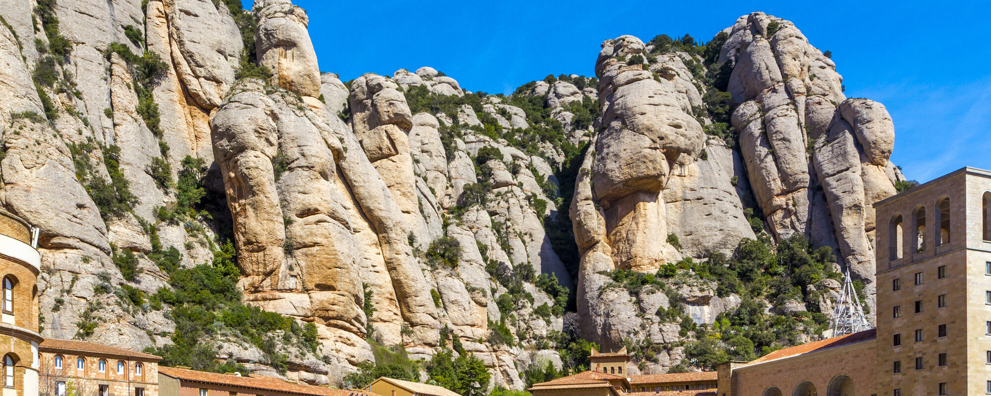 Santa Maria de Montserrat abbey in Monistrol in beautiful summer day, Catalonia, Spain