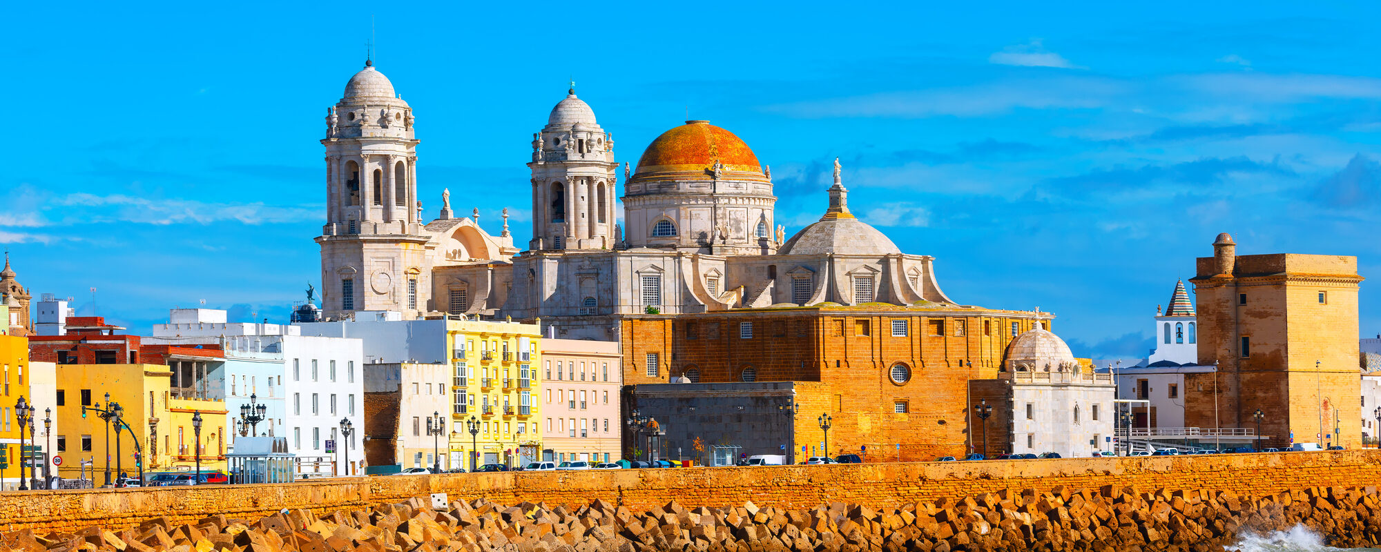 Cadiz city with a large cathedral on the coast